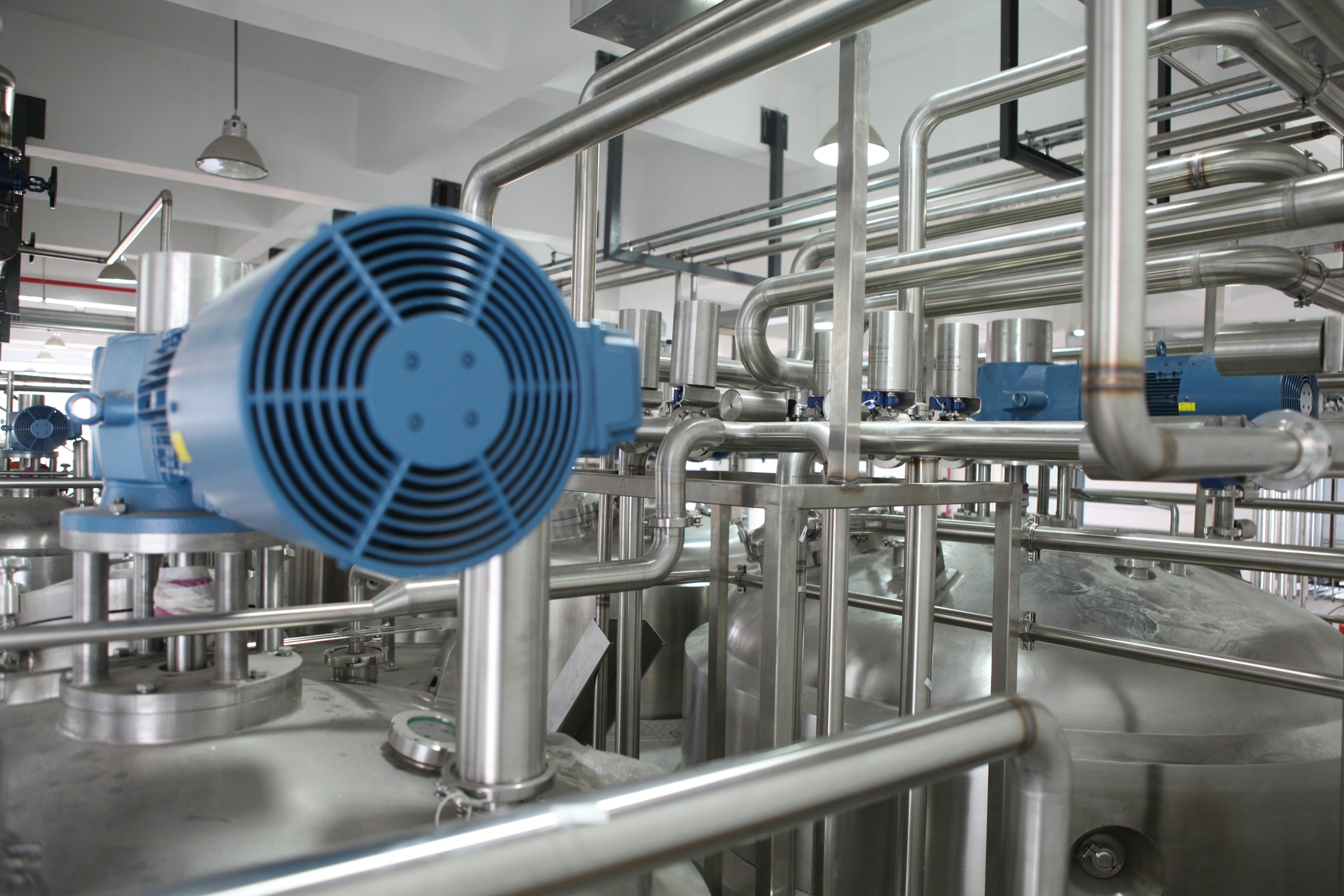 Industrial stainless steel piping and pump systems in an engineering plant